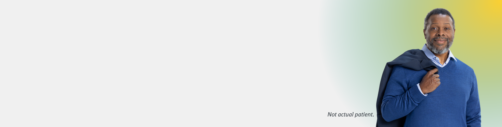 Man Holding Coat Over Shoulder