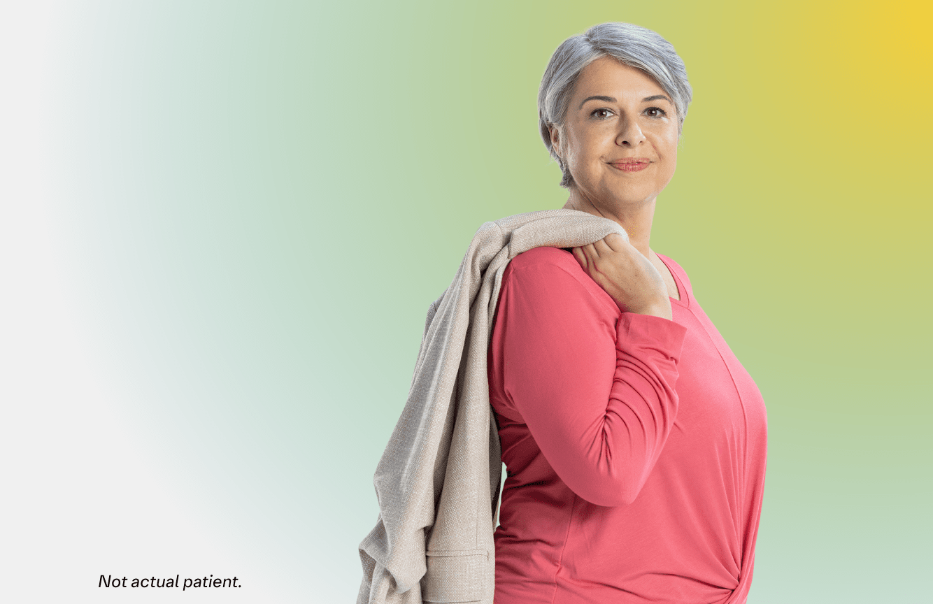Mature woman smiling and standing sideways